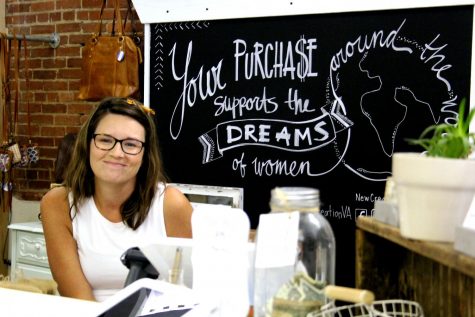 Volunteer coordinator and shop manager Christina Swecker greets customers with a smile at New Creation. The business is located in the Agora Market of downtown Harrisonburg. 