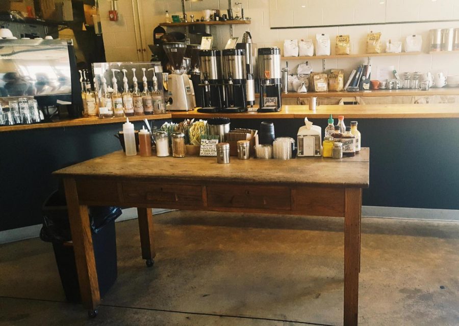 This photograph shows the table where customers can get some plain coffee and come to the table and spice it up.