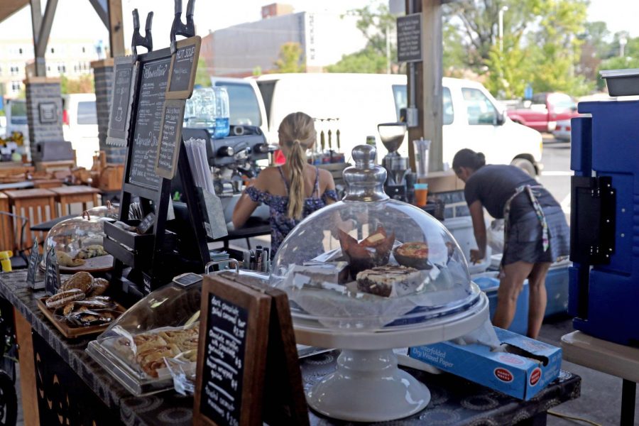 Heather Benin and her daughter Ella prepare coffee at Sugar Bean and Baking Company located at the Farmers Market.