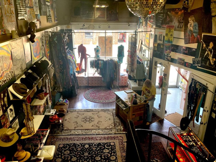 Shopowner Mike Harlow sits behind the register at Water Street Vintage and Bohemian. "I get new people everyday, whether they’re locals or out-of-towners.” Harlow said. Photo by Sofia Danielli