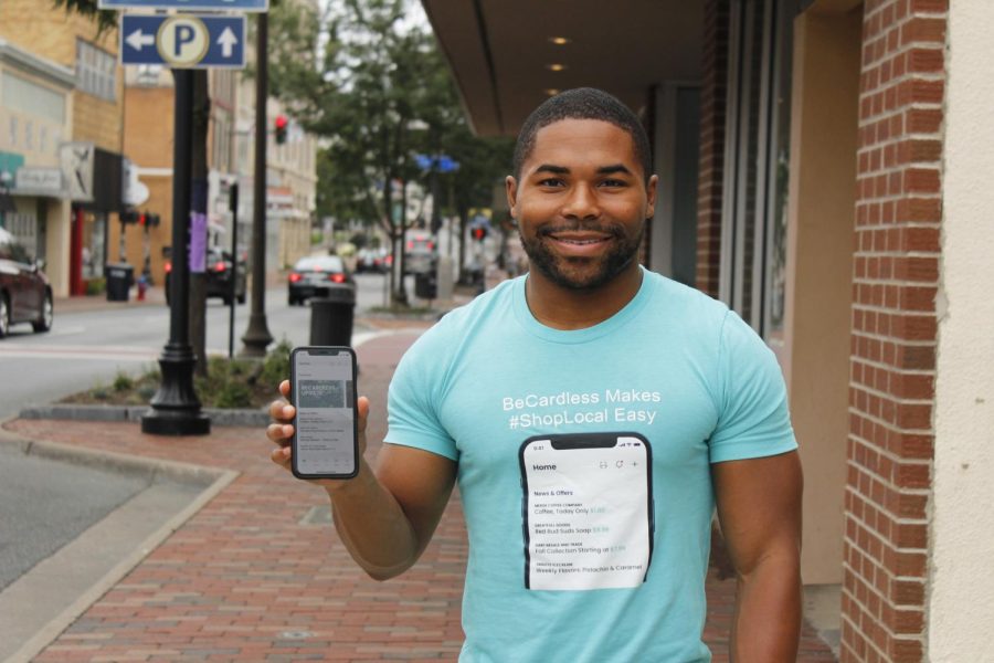 Nick Koger presents his app, BeCardless, while in Downtown Harrisonburg July 20. He had always been passionate about making local shopping more accessible. “I'm trying to develop a way for new businesses to be successful and thrive because there are a lot of great innovative ideas,” Koger said.
