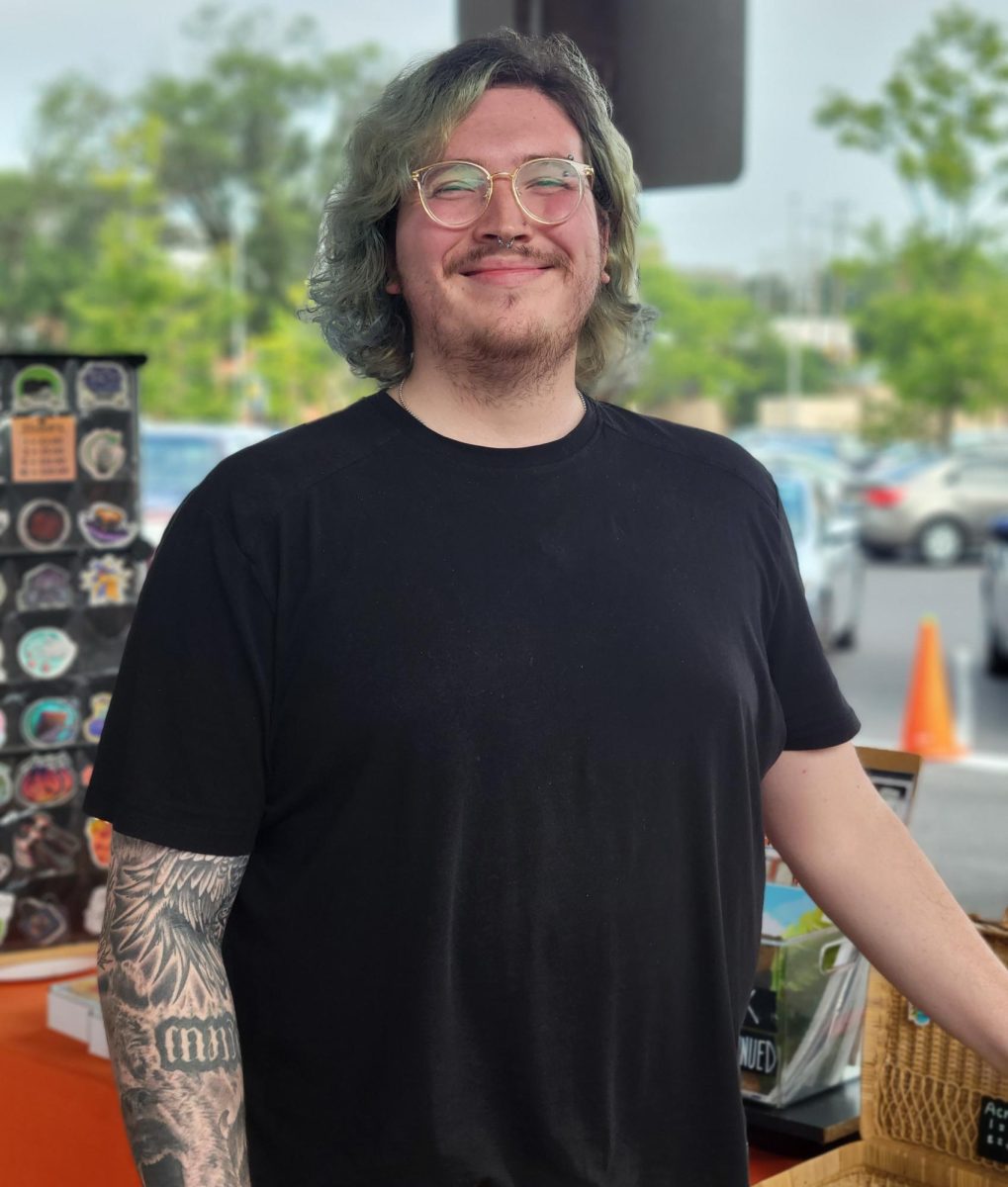 Dandy Knopf sells art work at Harrisonburg Farmers Market. Knopf is the owner of the art shop Deviant Kreations.
