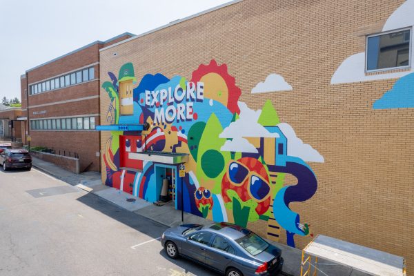 Graphic designer and co-founder of Earth Surprise Murals, Matt Leechs mural on the side of the  Explore More Discovery Museum. Photo courtesy of Matt Leech

