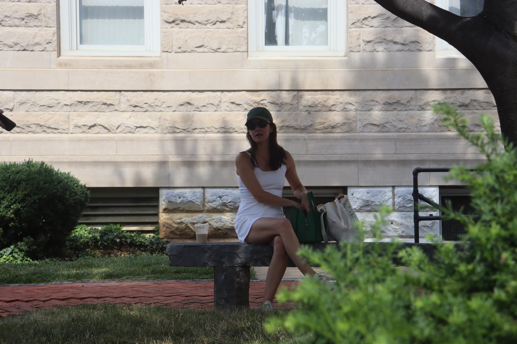 Valerie Reese sits in the shade in downtown Harrisonburg while avoiding the hot weather on July 9th. Reese spends her time working as an epidemiologist, but at home she spends time outside enjoying her two acres of land with her family. “Not having music and just learning to hear the sounds of nature. I believe that it has a healing component to it, and it kind of resets me and the children,” Reese said.
