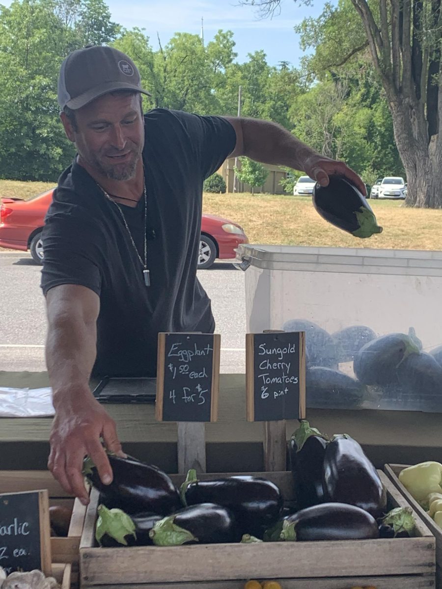 Fisher helps out other local businesses at the Farmers Market in his free time.