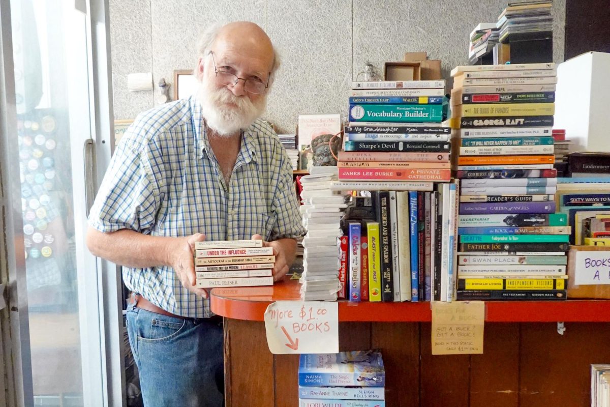 Bob Schurtz, owner of Downtown Books, poses for a photo in his store in downtown Harrisonburg.
