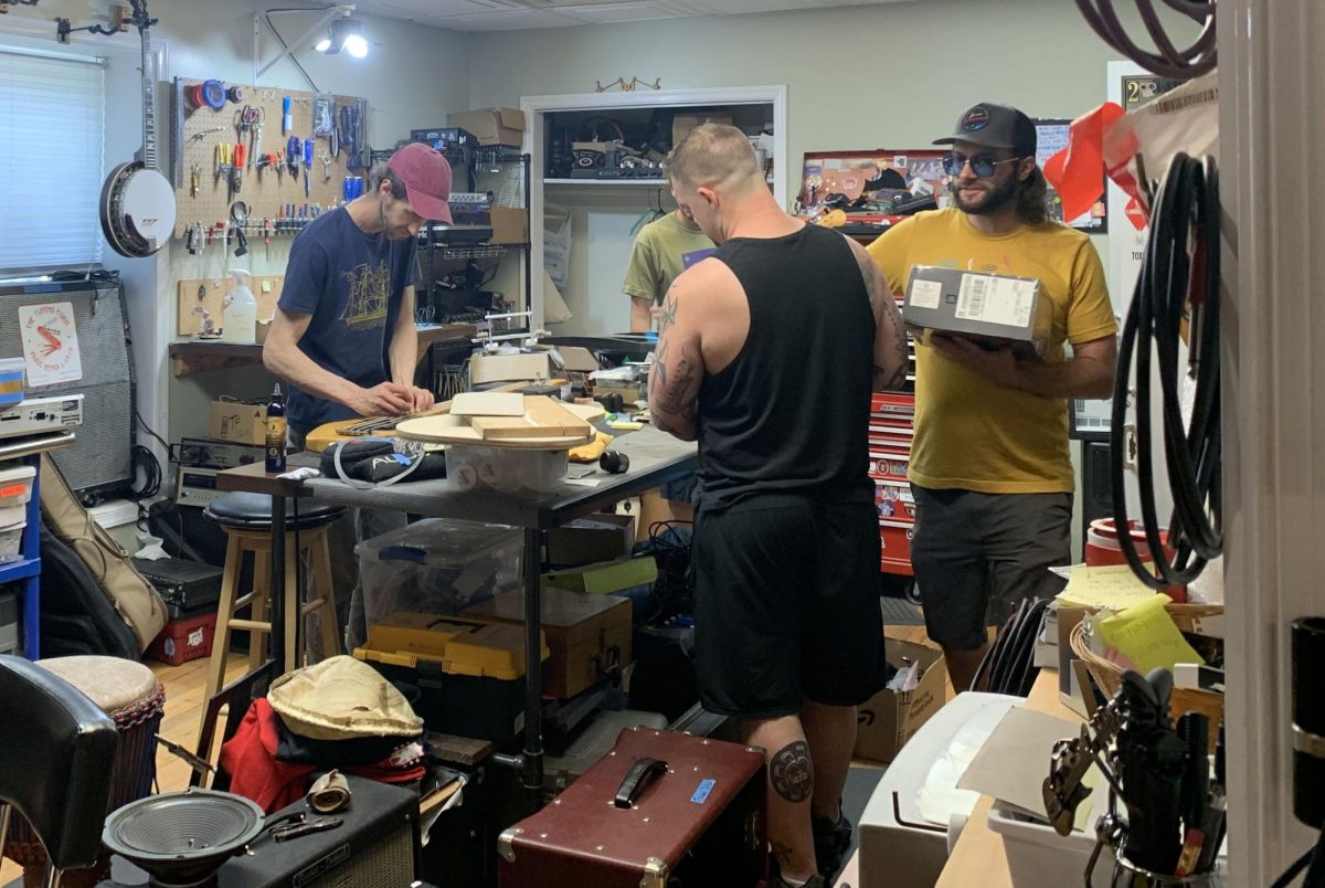 Workers repair instruments at The Tuning Fork, a staple of the Harrisonburg music scene. 